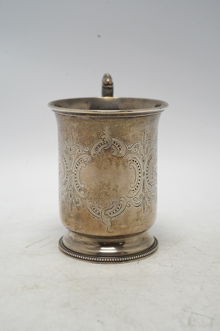 A Victorian engraved silver christening mug, by Edward Charles Brown, London, 1872, 11cm, 5.4oz. Condition - fair to good